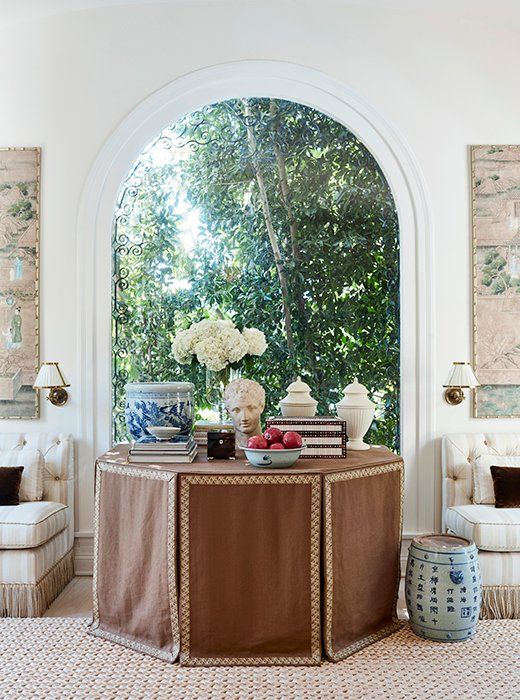 Mark D Sikes Los Angeles Home Brown Skirted Table Blue White Ginger Jar Banquettes Tassel Trim