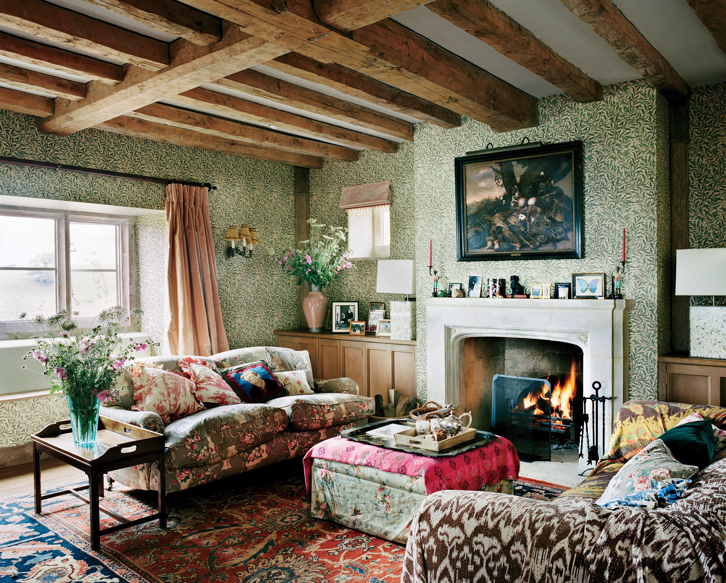 Plum Sykes English Country House William Morris Wallpaper Willow Boughs Chintz Roll Arm Sofa Fireplace Mantle Exposed Beams