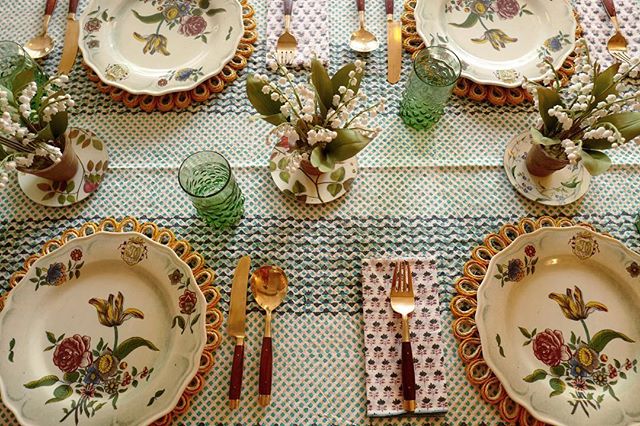 Block print tablecloth and floral dinner plates on a table setting in Amanda Brooks' new Cotswolds boutique, Cutter Brooks, in Stow-on-the-Wold, England
