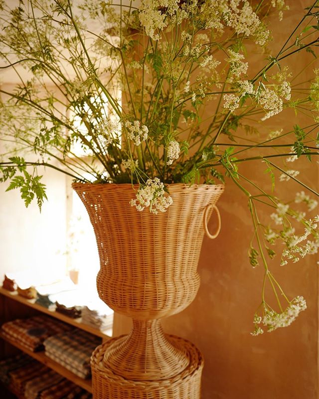 Amanda Brooks' new Cotswolds boutique, Cutter Brooks, in Stow-on-the-Wold, England. Wicker pedestal and urn by Atelier Vime.