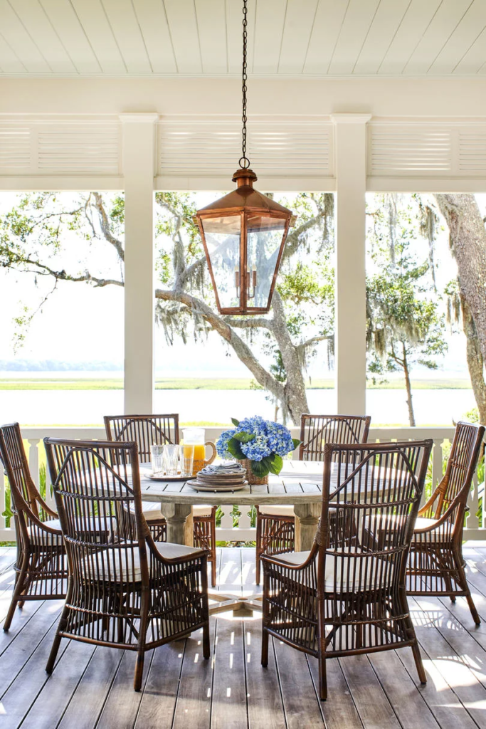 Round Outdoor Dining Table Porch Hydrangea Bouquet in Vase Copper Lantern Bamboo Chairs Heather Chadduck Interiors Southern Living Idea House 2019