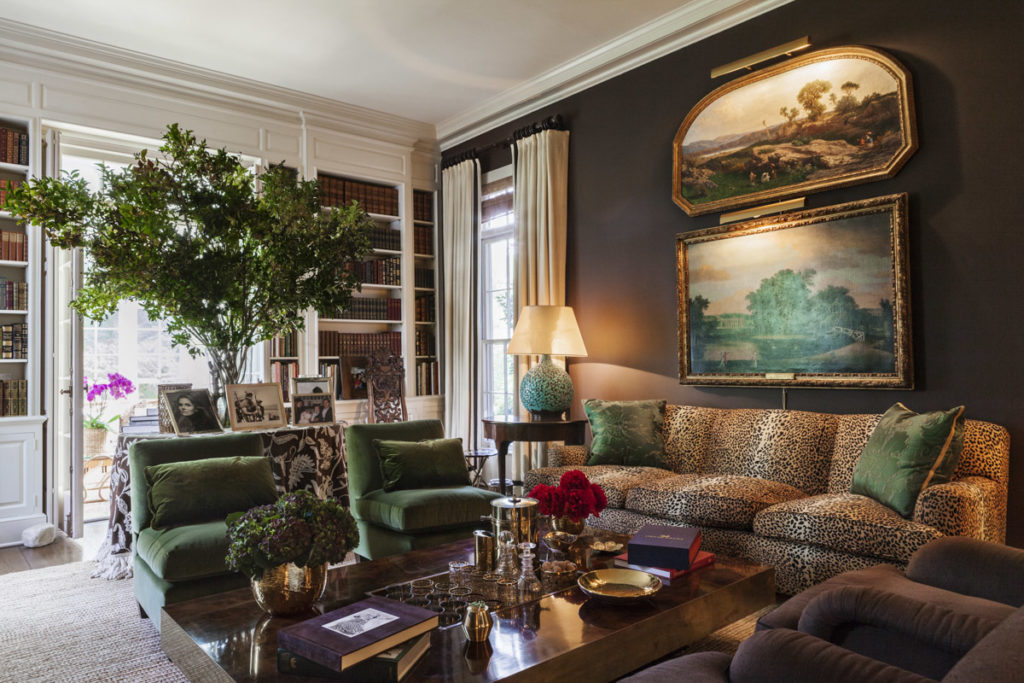Aerin Lauder's East Hampton living room with chocolate brown walls and a leopard print sofa.