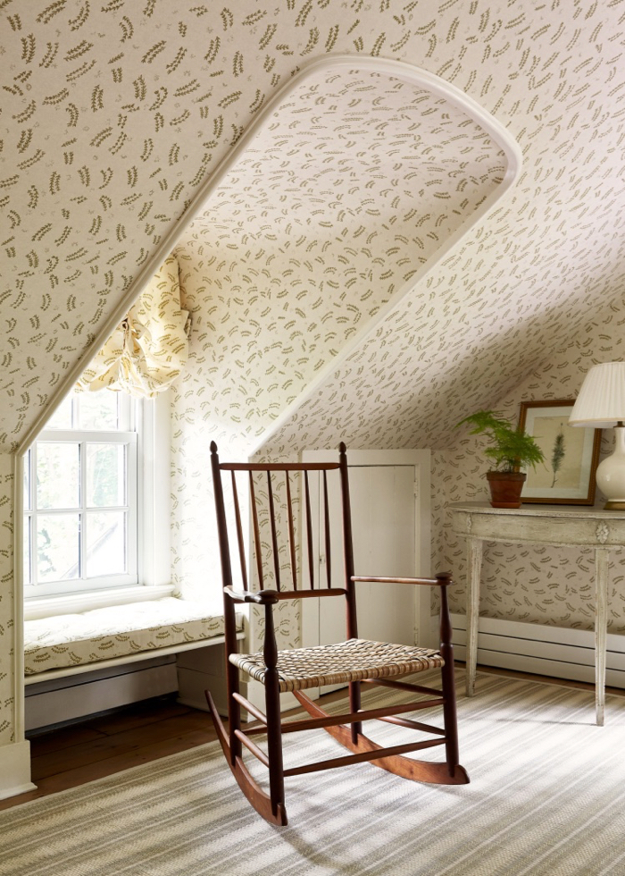 Attic room with wallpaper and window seat by McGrath II.