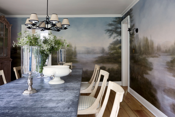 Dining room with landscape mural and Swedish gingham dining chairs decorated by McGrath II.