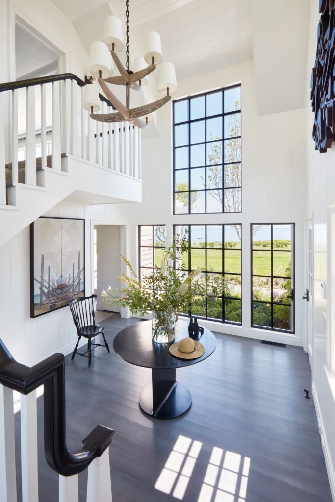 Martha's Vineyard cottage decorated by Victoria Hagan. Sunny double height foyer.
